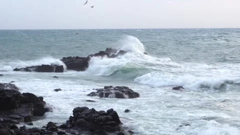 Waves crashing on a beach Stock Footage 332142350