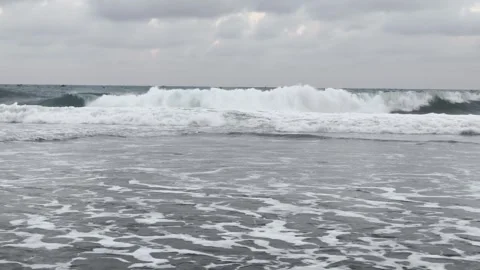 Waves crashing on the beach Stock Footage 340004259