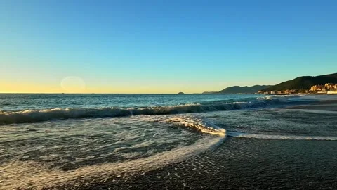 Waves crashing on the beach in Liguria Stock Footage 317700550