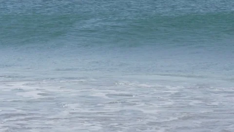 Waves crashing on a beach on a misty afternoon Stock Footage 74145437