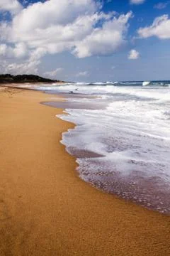 Waves crashing onto the beach Stock Photos
