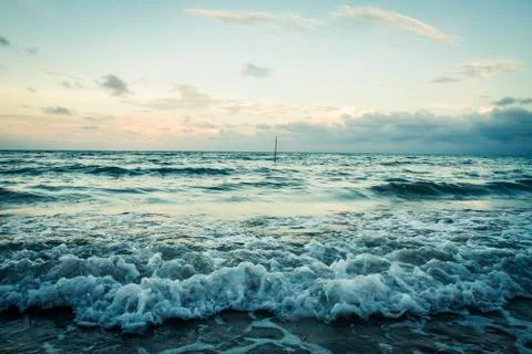 Waves crashing on a beach Stock Photos