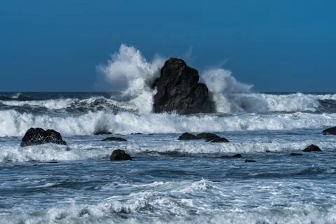 Waves crashing on the beach Stock Photos