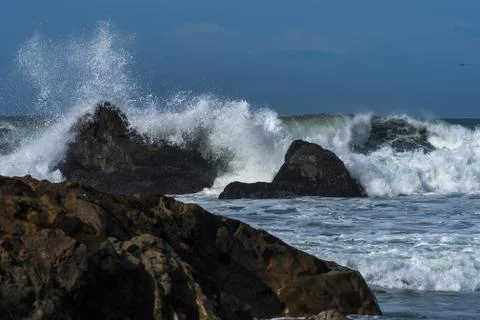 Waves crashing on the beach Stock Photos