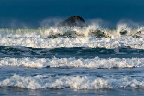 Waves crashing on the beach Stock Photos