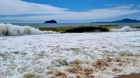 Waves crashing on the beach Stock Photos