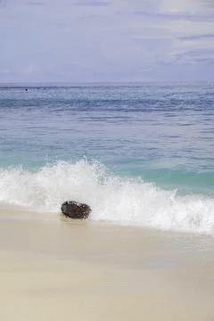 Waves crashing on the beach. Stock Photos