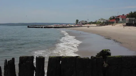 Waves Crashing On Beach, Pier Foreground Stock Footage 64637494