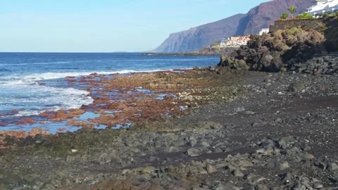 Waves crashing on the beach at Playa de la Arena, Tenerife Stock Footage 296840785
