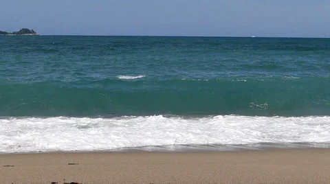 Waves crashing on the beach in slow motion Stock Footage 65966556