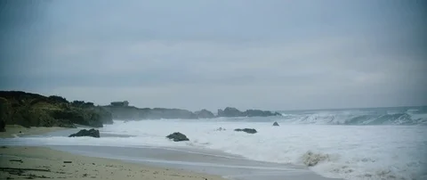 Waves crashing on the beach in slow motion Stock Footage 83846245