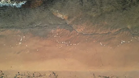 Waves crashing on beach, top down view. top down view Stock Footage 276945025