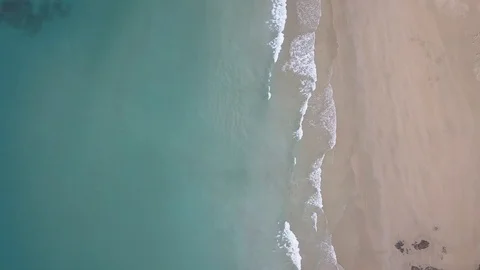 Waves crashing on beautiful empty beach with blue green water in Asia Stock Footage 91275296