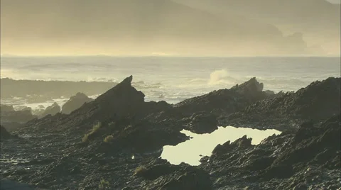 Waves crashing behind rocks Stock Footage 37163153
