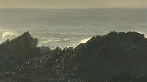 Waves crashing behind rocks Stock-Footage 37164310