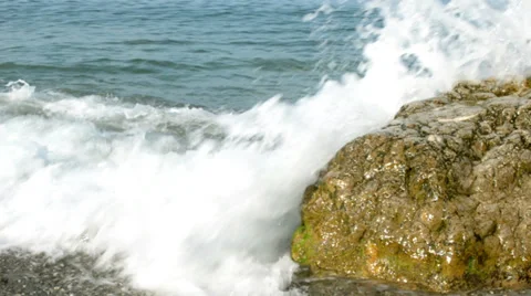 Waves crashing on big stone Stock-Footage 36756249