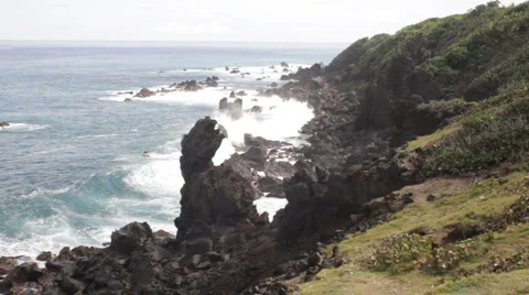 Waves crashing onto black rocks Stock Footage 998701