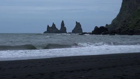 Waves crashing at black sand beach in Vik Iceland Видео 72325852