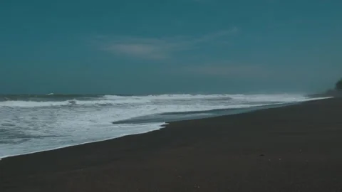 Waves Crashing on Black Sandy Beach at Goa Cemara in Yogyakarta Stock Footage 302525330