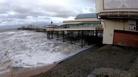 Waves crashing by Blackpool Pier Stock Footage