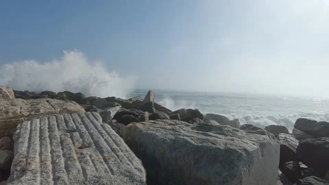 Waves crashing at the breakwater creating a big amount of spray. Video stock 193989237