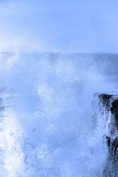 Waves crashing on burren cliffs Stock Photos