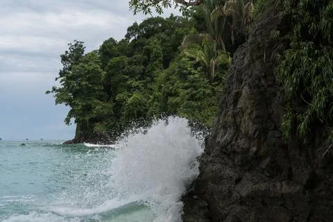 Waves crashing on the cliff Stock Photos