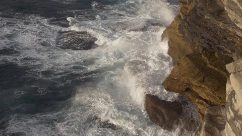 Waves Crashing on Cliffs Aerial View at Sunrise 库存影片 72436745