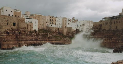 Waves crashing on the cliffs of Polignano a Mare during a storm in Adriatic Stock-Footage 331042678