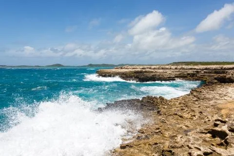 Waves crashing on coastline at devil's bridge antigua Stock Photos