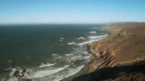 Waves crashing into the coastline Stock Footage 163990946