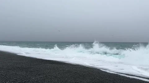 Waves crashing on the dark shore at Saint Vincent's Beach Newfoundland 動画素材 343133935