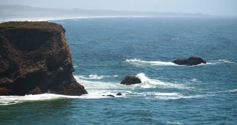 Waves Crashing On Distant Sea Stack Slow Motion 動画素材 159248765