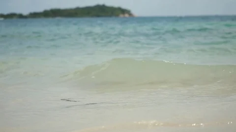 Waves crashing gently on quiet sandy beach. Slow motion. 1920x1080 Stock Footage 82120971
