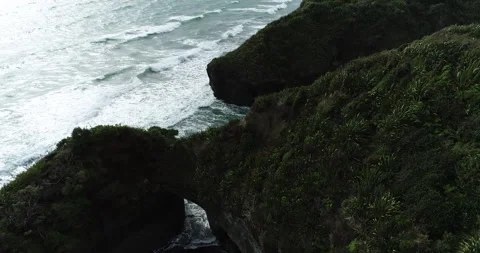 Waves crashing into hidden caves Stock Footage 151819016
