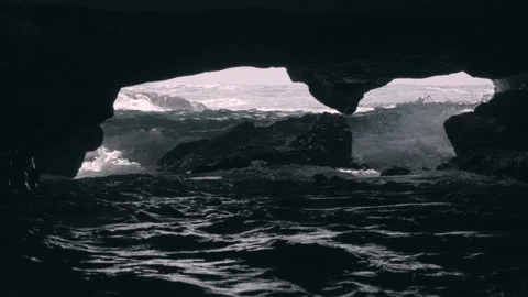 Waves crashing inside dark cave Honolulu Hawaii Stock Footage 312647946