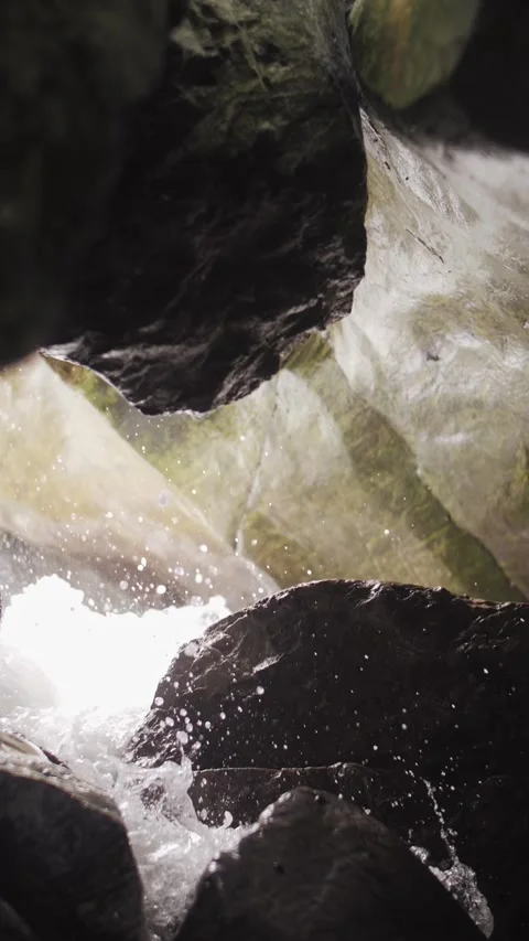 Waves crashing inside a sea cave on Sakhalin Island vertical video Stock Footage 321002188