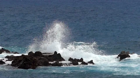 Waves crashing on lava rocks. Two play speed. Slow motion 스톡 동영상 67750069