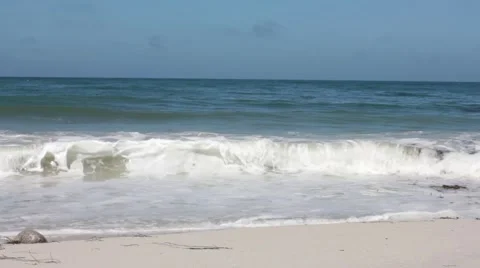 Waves Crashing, Man Jogging on Beach Stock Footage 56360703