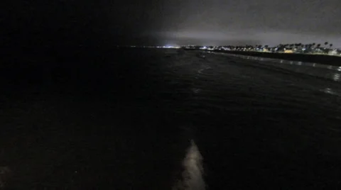 Waves crashing at night venice in background Vídeo Stock 35288019