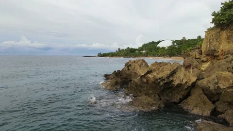 Waves Crashing on Ocean Rocks in Domes Beach Rincon Puerto Rico 4K Drone Shot Stock Footage 150464564
