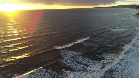 Waves crashing in the ocean while sunset in california Video stock 155462126