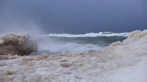 Waves crashing over ice Stock Footage 37232367