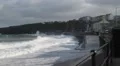Waves Crashing over railings into town in a big storm after a hurricane HD Footage