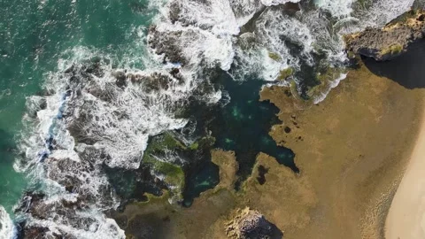 Waves crashing over reef Stock Footage 246049328