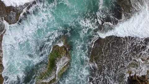Waves crashing over reef/ rock 4k60 Stock Footage 246041647