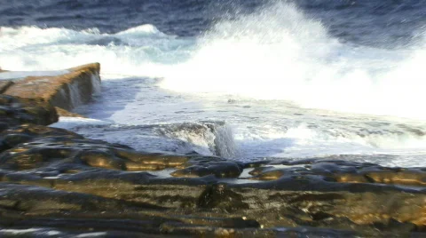 Waves crashing over rocks after the storm Stock Footage 749979