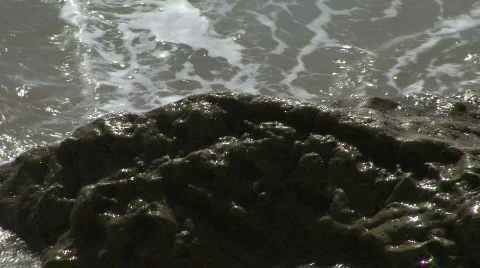 Waves crashing over rocks Stock Footage 659219