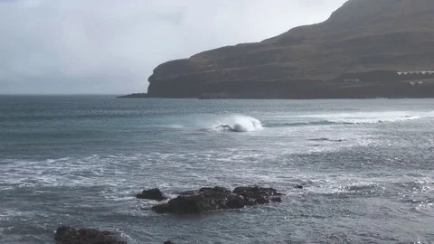 Waves crashing over rocks Stock Footage 78765245