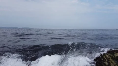 Waves crashing over rocks Stock Footage 137910546